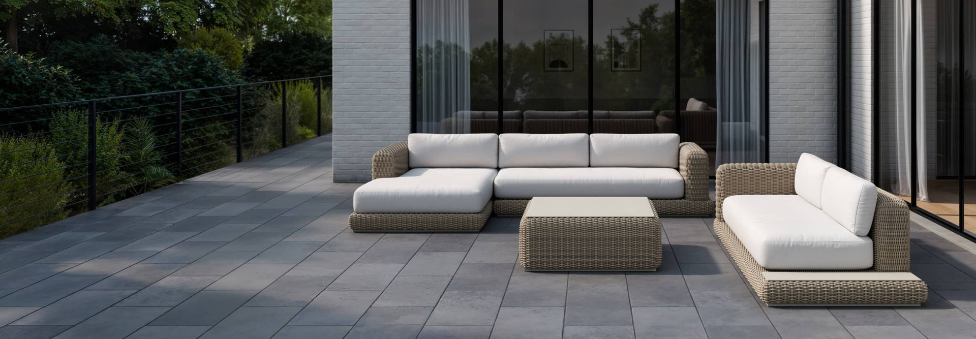 Neighbor modern wicker sectional on the deck of a luxury minimalist home