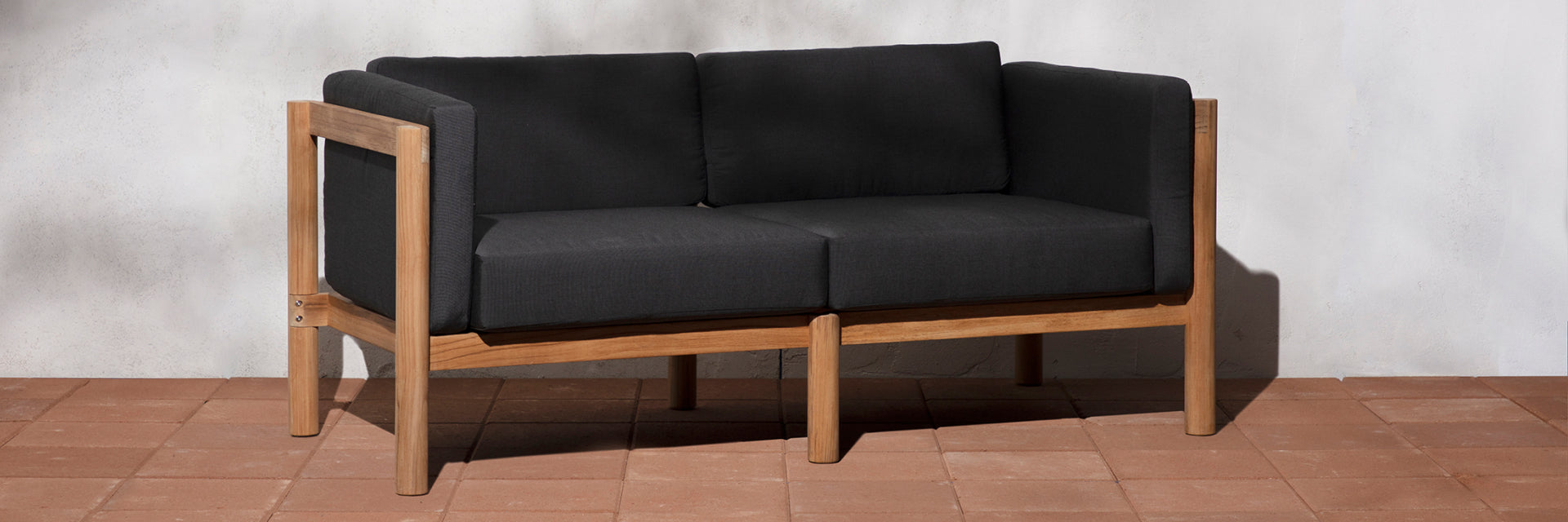 Neighbor outdoor loveseat with black cushions