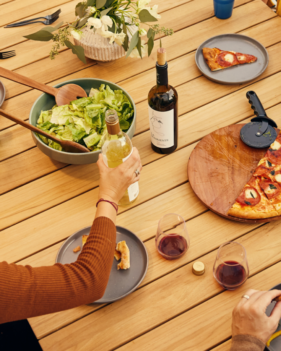 Neighbor teak outdoor dining table with food