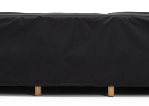 Outdoor sofa covered by a black protective cover