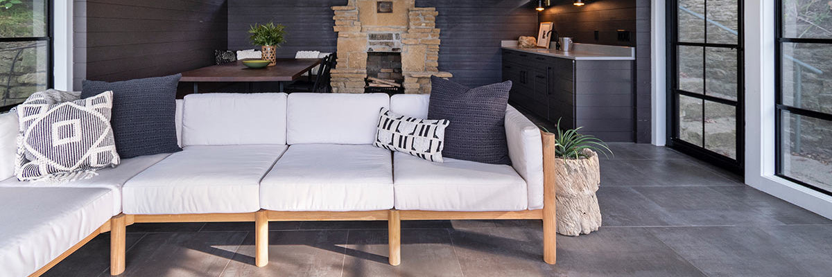 Neighbor outdoor sectional with throw cushions on a backyard