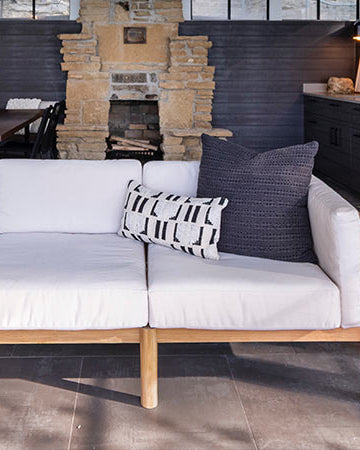 Neighbor outdoor sectional with throw cushions on a backyard