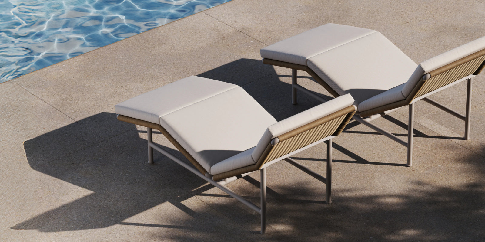 Closeup of Neighbor Camber Chaise Lounge wicker arm and cream cushion edge in poolside setting