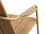 Neighbor Hopper Chair detail shot showing armrest and seat joinery with wood grain texture and metal frame connection