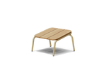 Neighbor Hopper Ottoman in sand finish, three-quarter view, light wood seat with tan metal frame against dark background