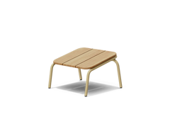 Neighbor Hopper Ottoman in sand finish, three-quarter view, light wood seat with tan metal frame against dark background