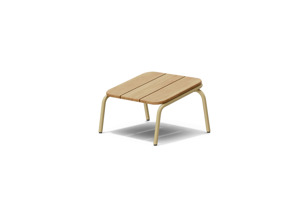 Neighbor Hopper Ottoman in sand finish, three-quarter view, light wood seat with tan metal frame against dark background