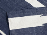 Neighbor Mesa Rug in Indigo, close-up of navy and cream striped geometric weave pattern with textured detail