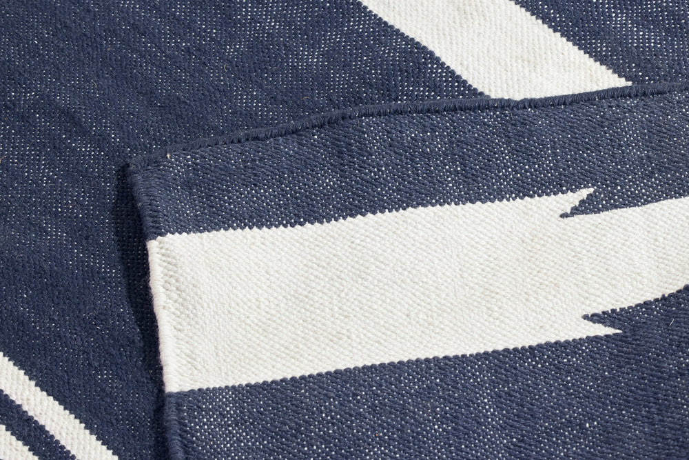 Neighbor Mesa Rug in Indigo, close-up of navy and cream striped geometric weave pattern with textured detail