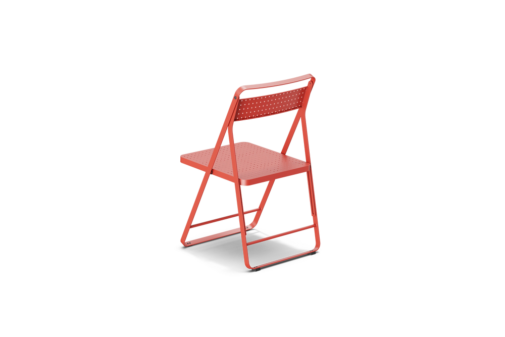 Neighbor Take Two Bistro Chair, an all-metal folding chair with perforated steel seat and backrest in coral red, rear three-quarter angle view.