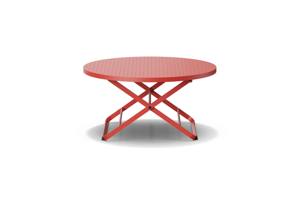Neighbor Take Two Coffee Table, a round folding outdoor coffee table with a perforated steel top in coral red, side profile view.