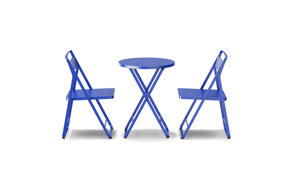 Neighbor Take Two Dining Set with two folding chairs and a matching round folding table in ultramarine blue, side profile view.