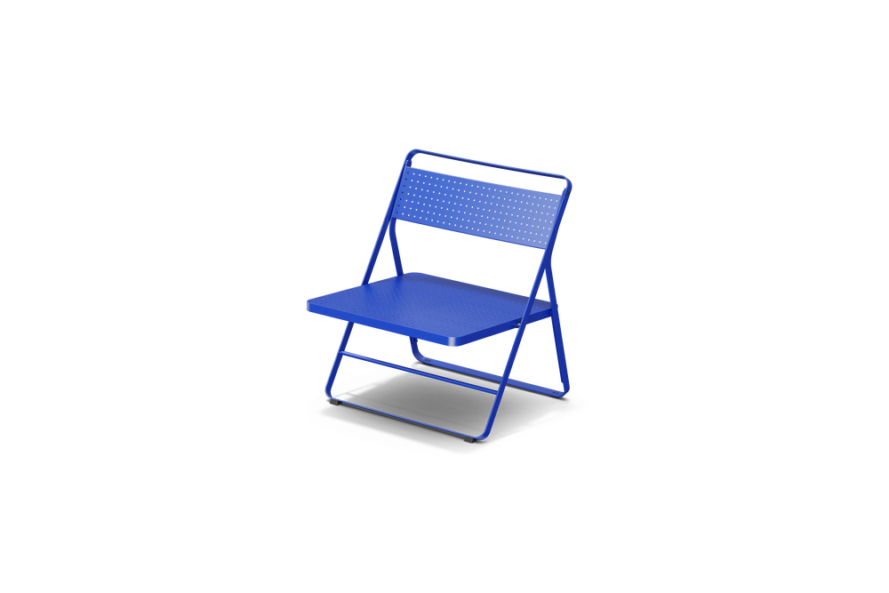 Neighbor Take Two Lounge Chair, a low-slung folding chair with perforated steel seat and backrest in ultramarine blue, three-quarter angle view.
