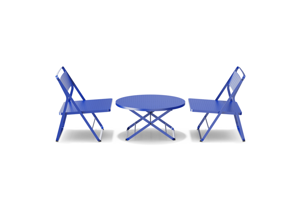 Neighbor Take Two Lounge Set with two perforated-steel folding lounge chairs and a matching round folding coffee table in ultramarine blue, side profile view.