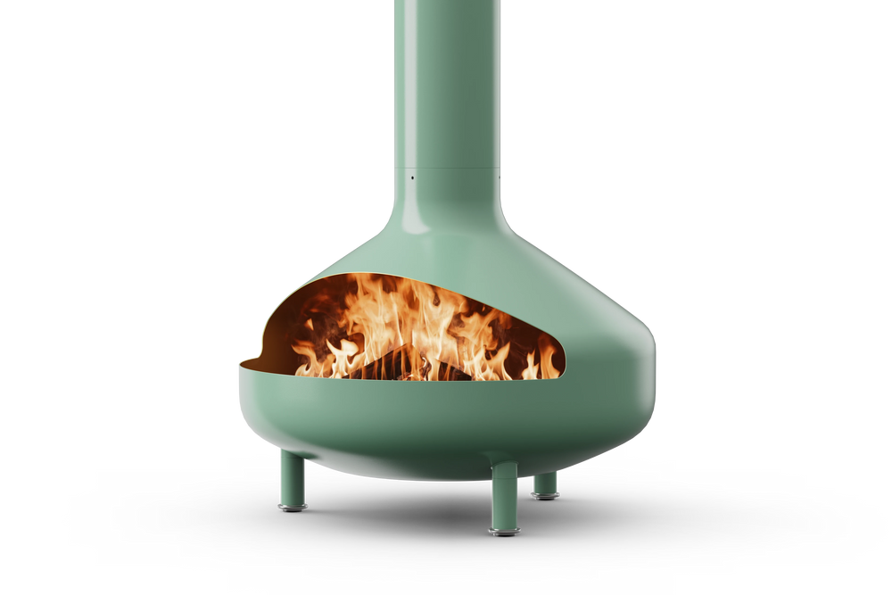 Neighbor Totem Chiminea, a sculptural enameled-steel outdoor fireplace with a rounded firebox and tall chimney on tripod legs in agave sage green enamel finish, three-quarter angle with logs burning inside the firebox.