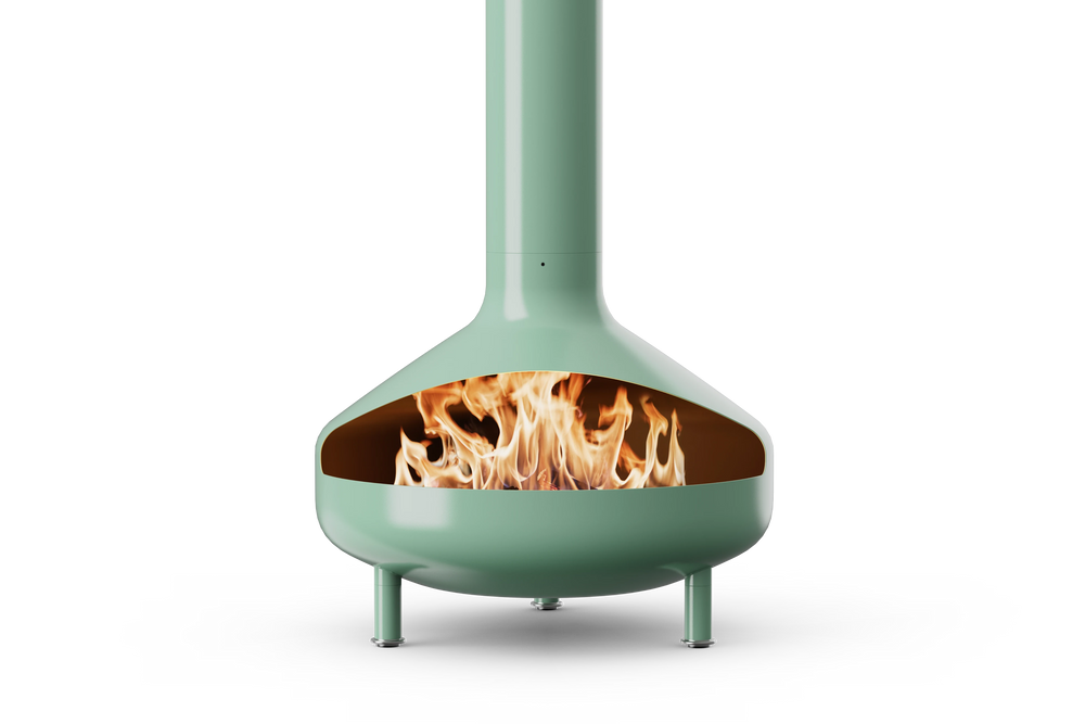Neighbor Totem Chiminea, a sculptural enameled-steel outdoor fireplace with a rounded firebox and tall chimney on tripod legs in agave sage green enamel finish, front view with logs burning inside the firebox.
