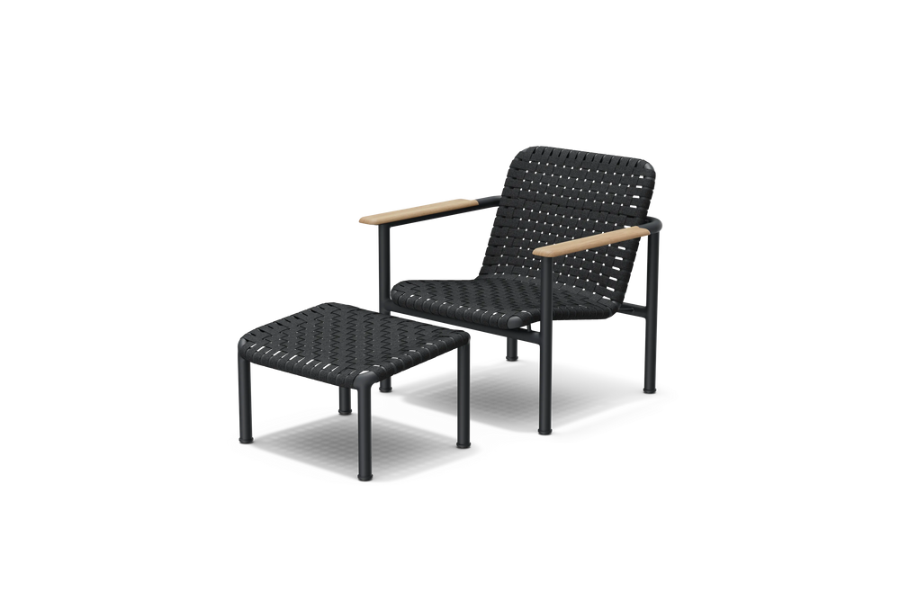 Neighbor Up-Down Chair shown together with the matching Up-Down Ottoman in charcoal black, three-quarter angle view.