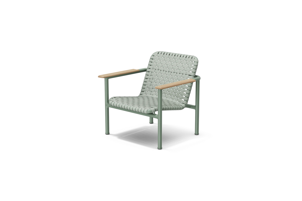 Neighbor Up-Down Chair, a woven-strap lounge chair on a powder-coated steel frame with natural wood armrests in juniper green-blue, three-quarter angle view.
