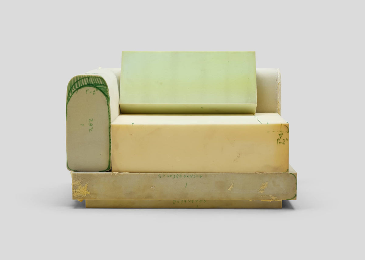 Exploded view of outdoor sofa construction showing stacked foam cushion layers and structural frame components