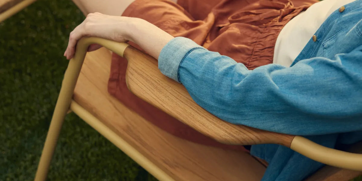 Person sitting in Hopper Chair showing natural armrest placement for comfortable arm positioning