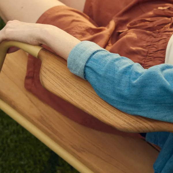 Person sitting in Hopper Chair showing natural armrest placement for comfortable arm positioning