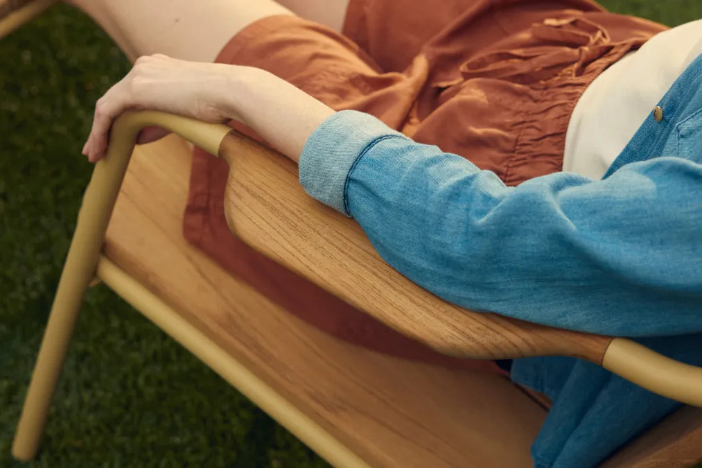 Person sitting in Hopper Chair showing natural armrest placement for comfortable arm positioning