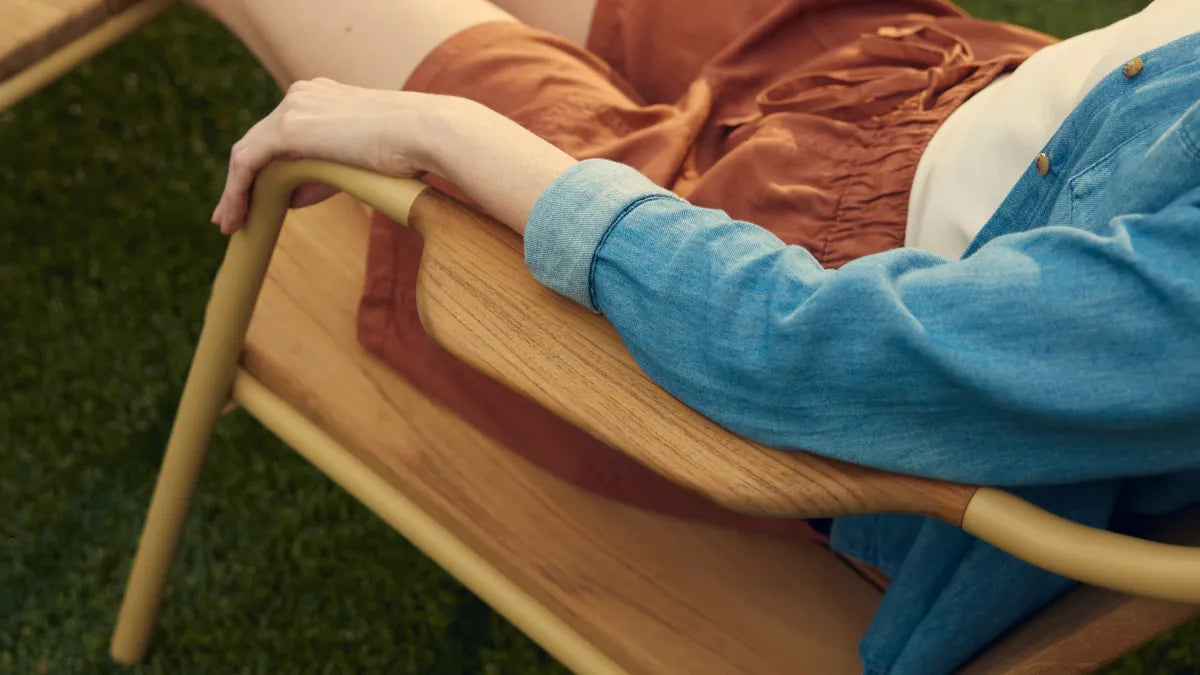 Person sitting in Hopper Chair showing natural armrest placement for comfortable arm positioning