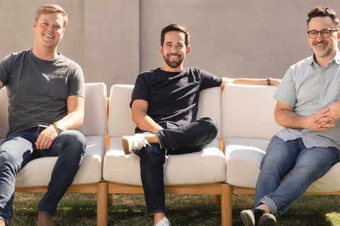 Neighbor's co-founders, Chris Lee, Nick Arambula, and Mike Fretto sitting on an outdoor sofa.