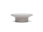 Neighbor Brim Fire Table in Stone, a round pale gray natural gas fire table with a wide flared top, cylindrical base and lid on.