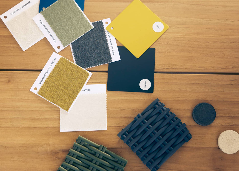Color swatches and textured samples on a wooden surface