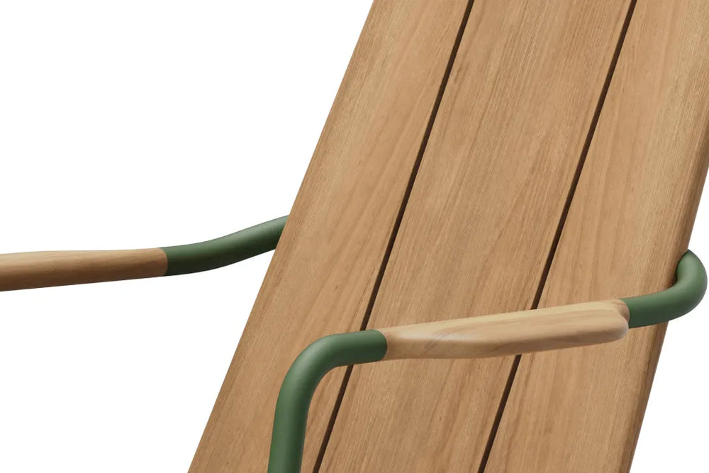 Close-up of Hopper Chair's wooden slat backrest with metal armrest, showcasing wood texture and frame construction