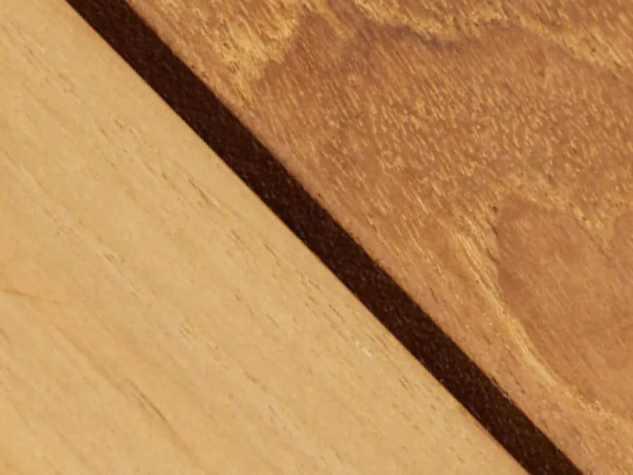 Close-up detail of natural wood showing grain and color variation, highlighting the Hopper Chair's wood craftsmanship