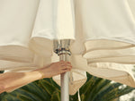 Multiple angles of woman opening a Cast Umbrella using the Flick Lift System™, an auto-lift canopy device.