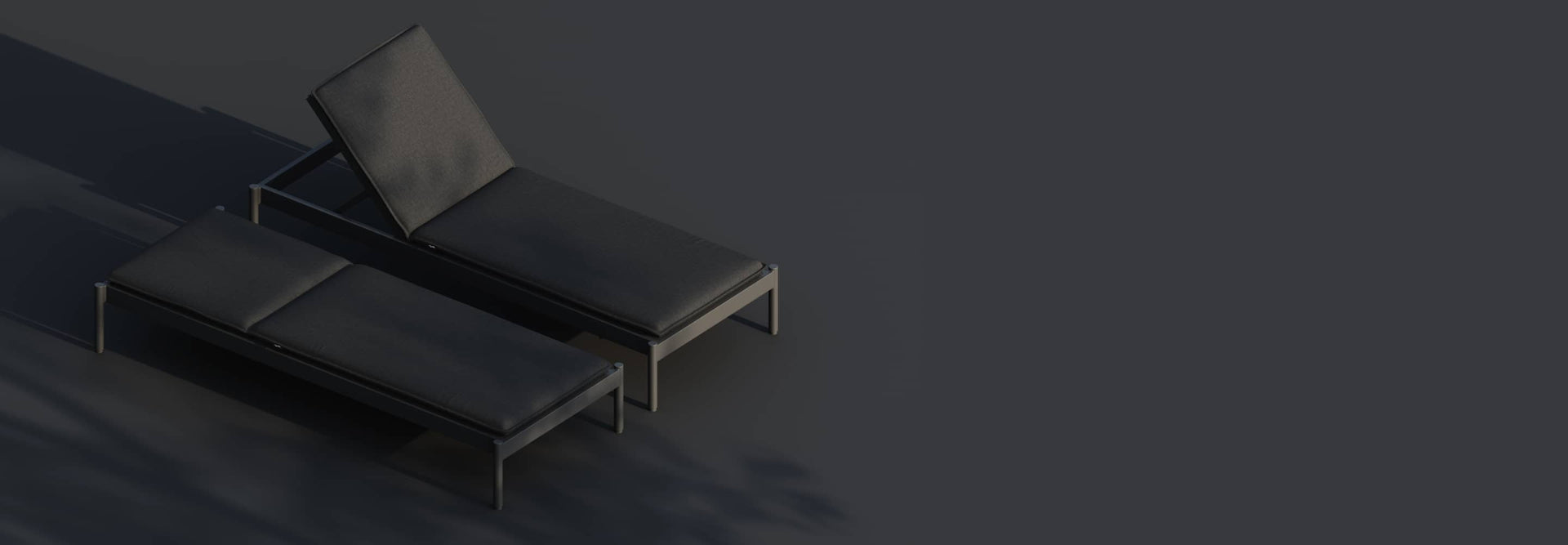 Two sun loungers side-by-side on a dark background with some shadows from trees overhead.