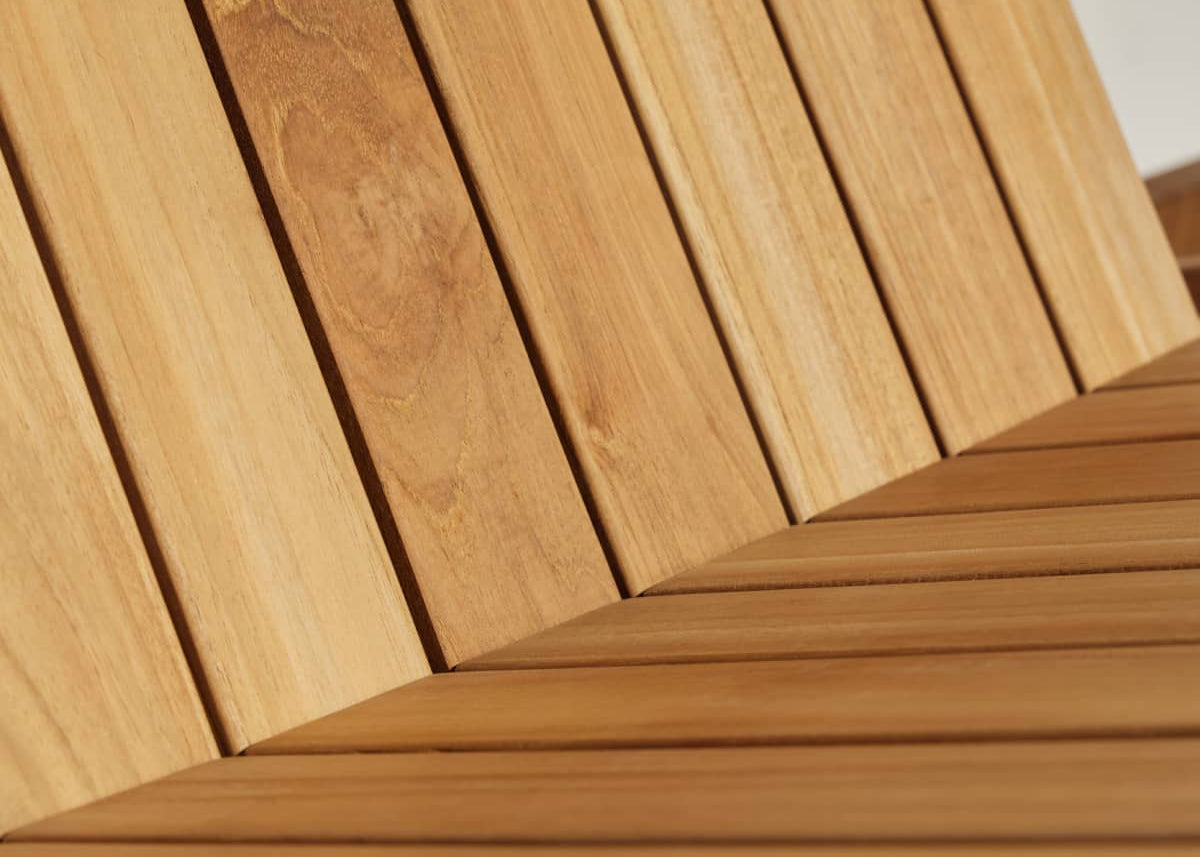 Close-up of teak planks from a portion of outdoor furniture